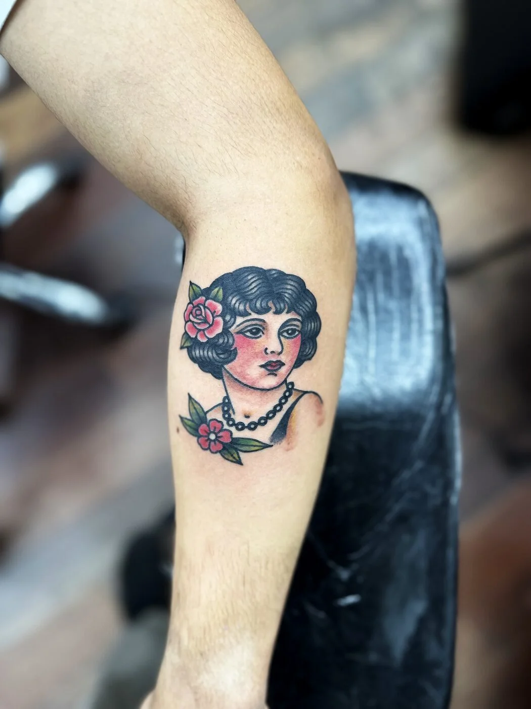 American Traditional pin-up woman with rose and pearls tattoo on calf by 2bit (Chris Curren) at Lost at Sea Tattoo, Chinatown, Honolulu