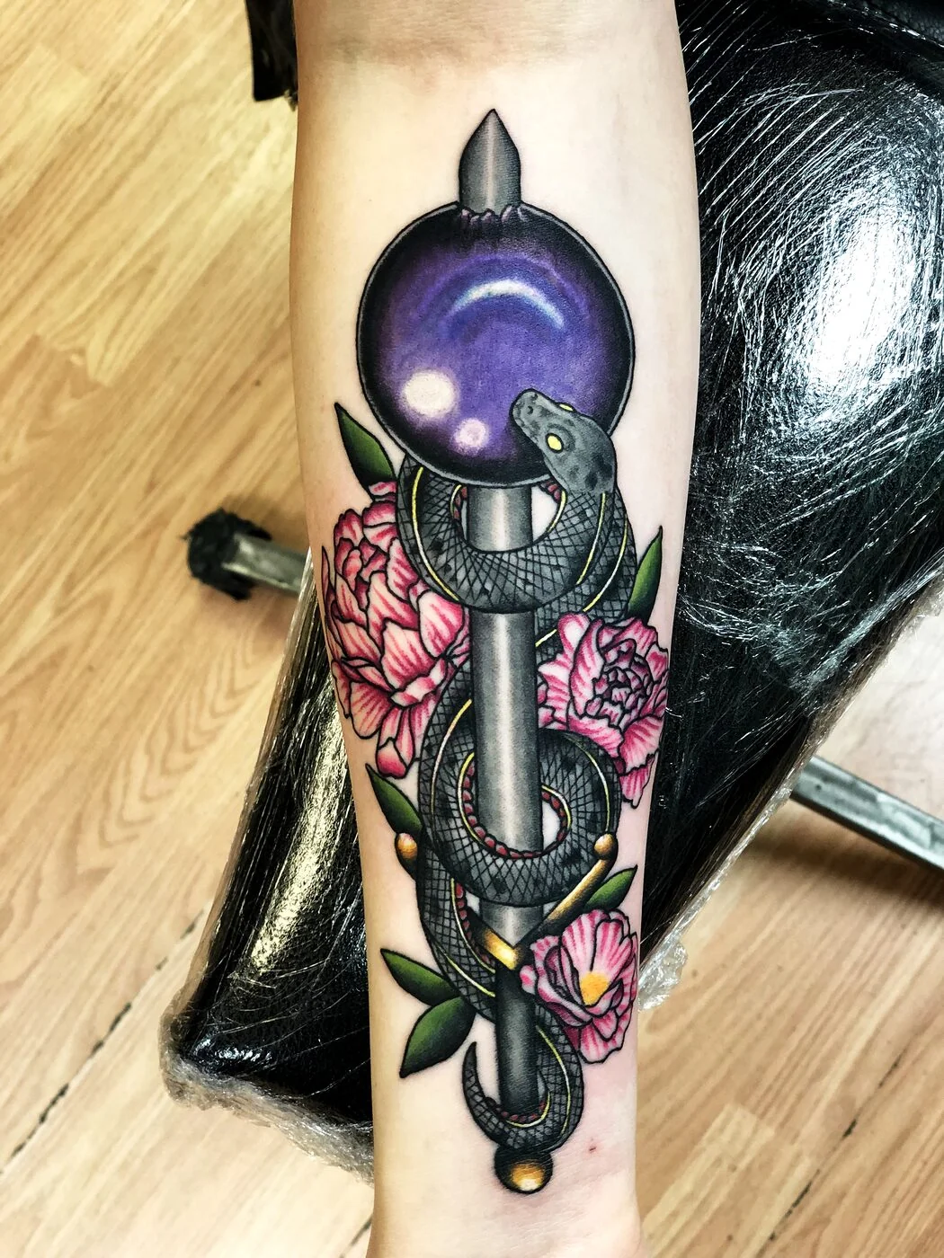 Neo-Traditional snake wrapped around staff with crystal ball and peonies tattoo on forearm by 2bit (Chris Curren) at Lost at Sea Tattoo, Chinatown, Honolulu